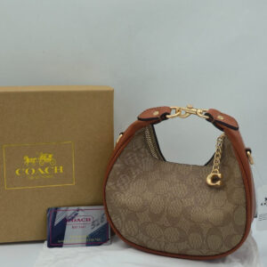 coach small jonie 22 half moon leather shoulder bag in signature canvas & brown 2088