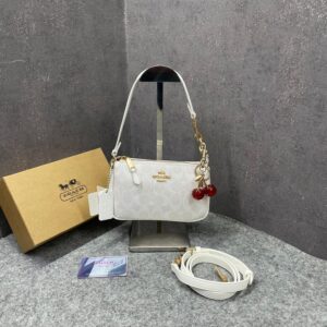 coacch nolita 19 white with cherry charm in signature canvas presbyopia white with og box & dust cover white 9923